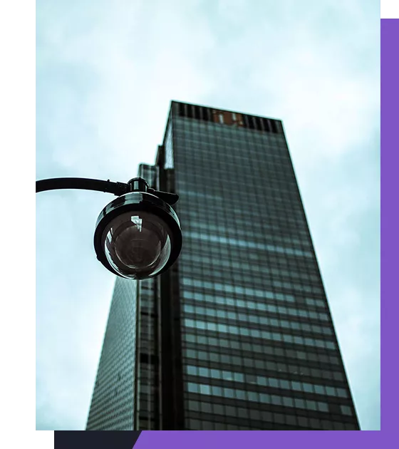 Security camera in front of a skyscraper